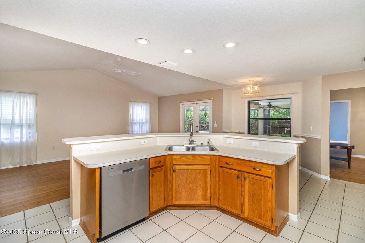 An open kitchen and gathering room, AI-enhanced from the listing's MLS photography